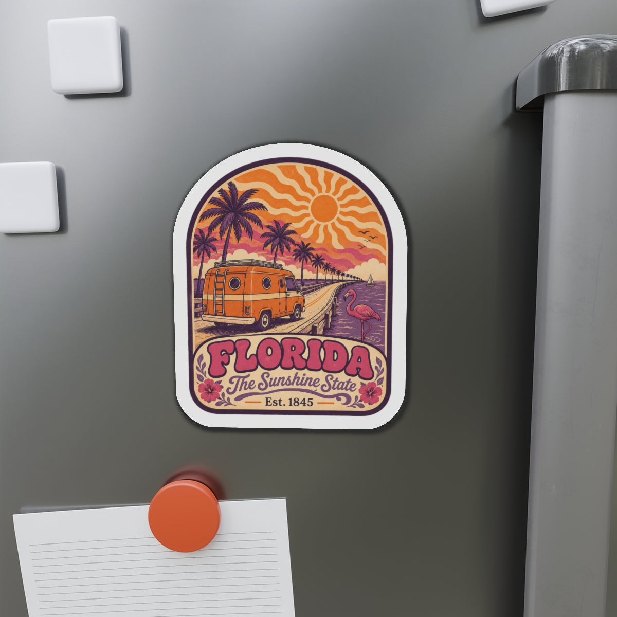 Florida die-cut magnet featuring retro van, palm trees, flamingo, and sunburst design