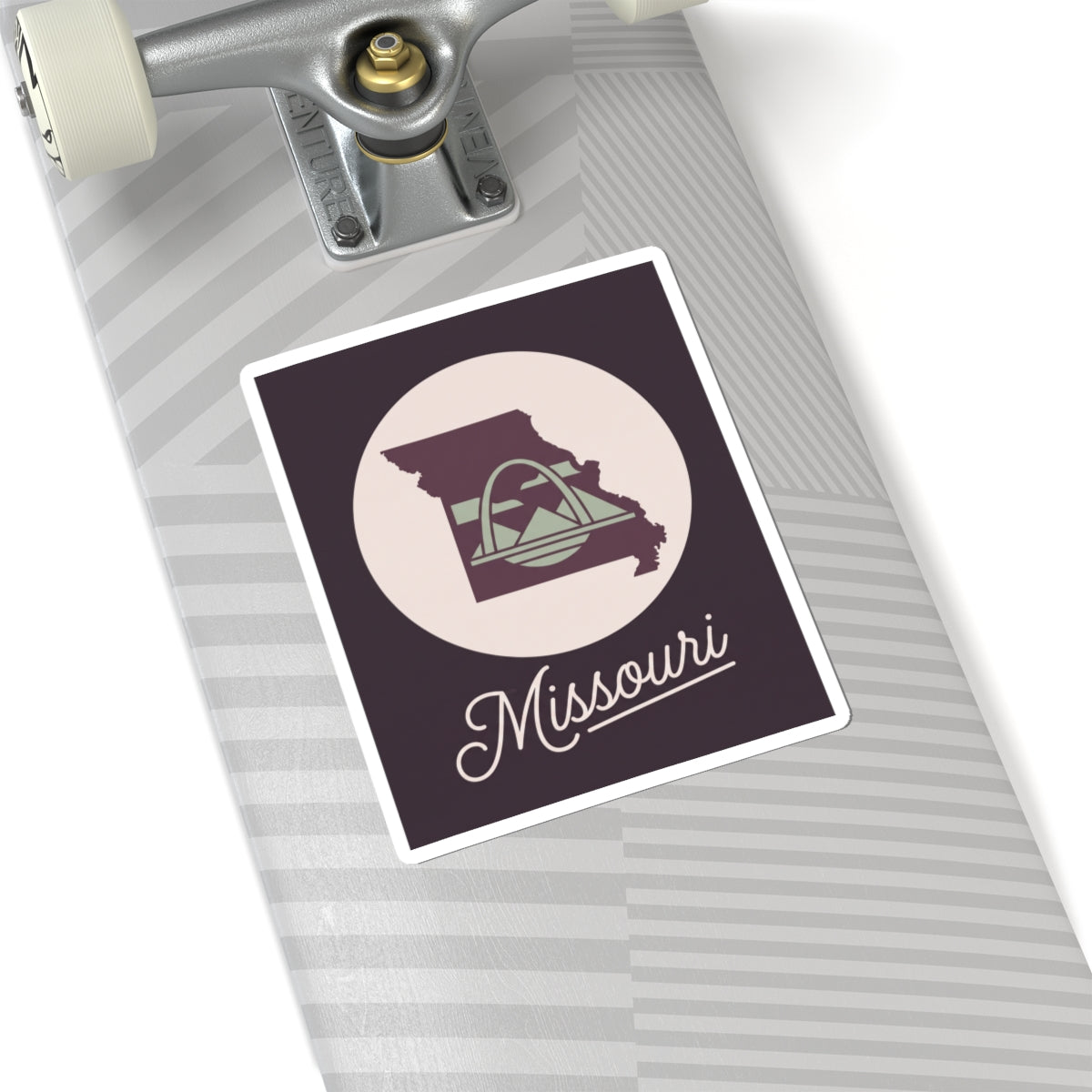 Missouri sticker decal on a surface, dark purple square with circular emblem and script