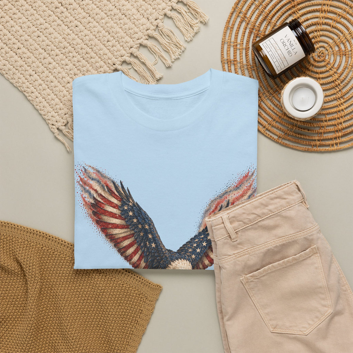 Light blue T-shirt with distressed American flag eagle wings graphic on front
