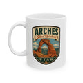 White ceramic mug with Arches Utah shield graphic and Stone Rainbows text