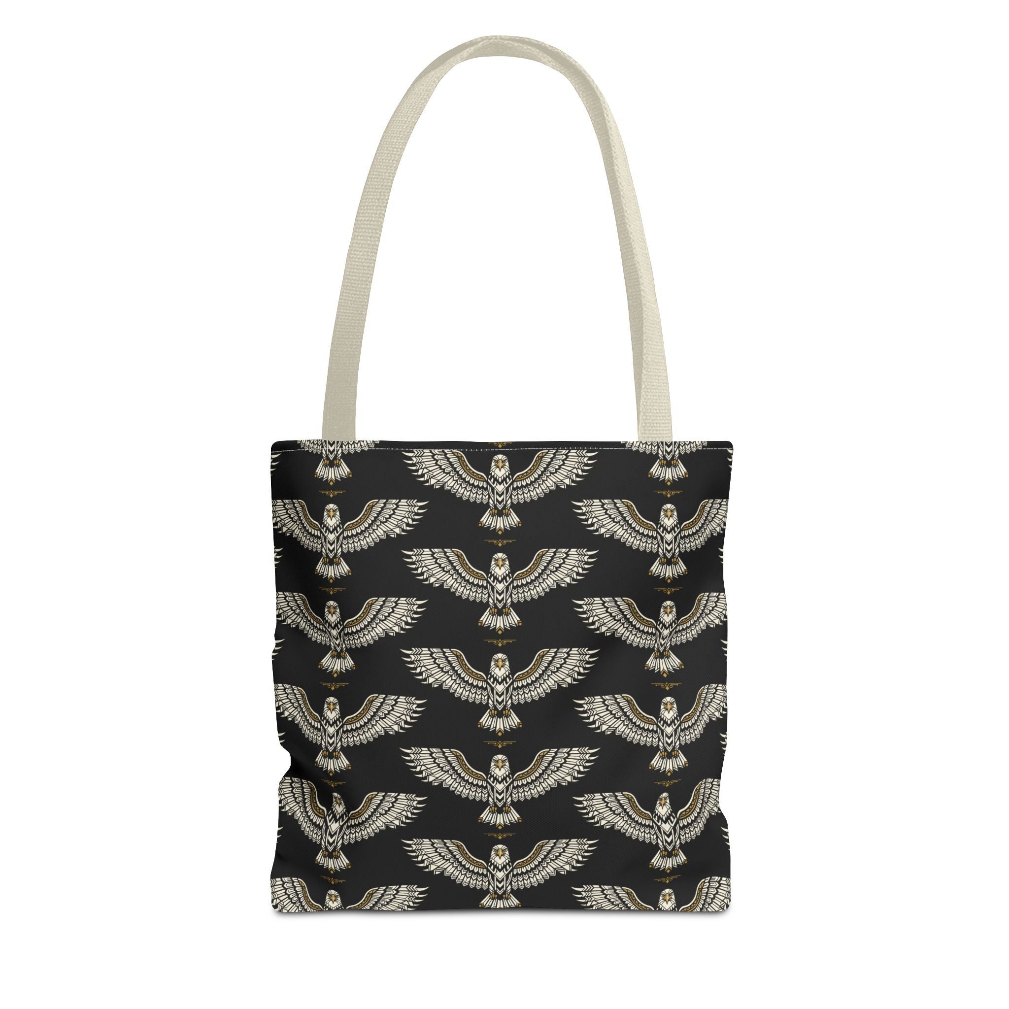 Tote bag with winged scarab pattern, black background, gold emblems, cream handles