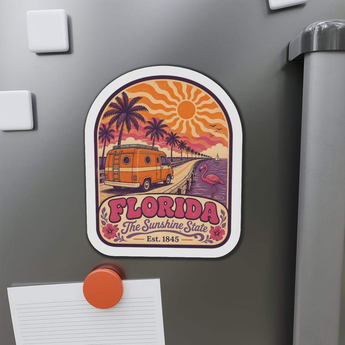 Retro Florida die-cut magnet showing vintage van, flamingo, palm trees, and sunrise