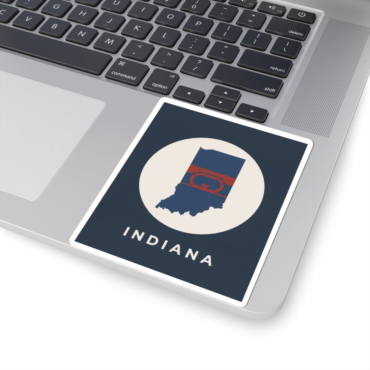 Indiana state map flag kiss-cut sticker on laptop trackpad area
