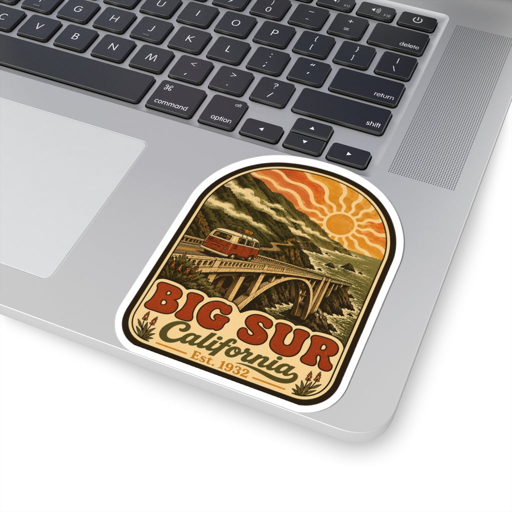 Kiss-cut Big Sur California sticker on laptop, coastal bridge and red camper van with sun.