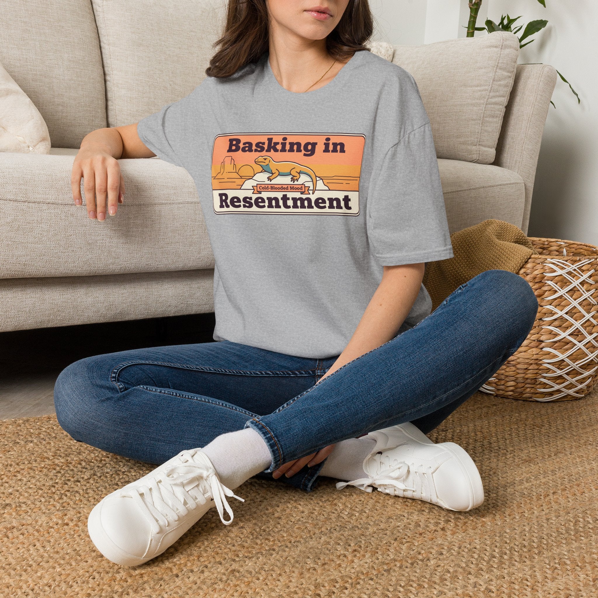 Heather gray crew-neck T-shirt with “Basking in Resentment” desert lizard graphic.