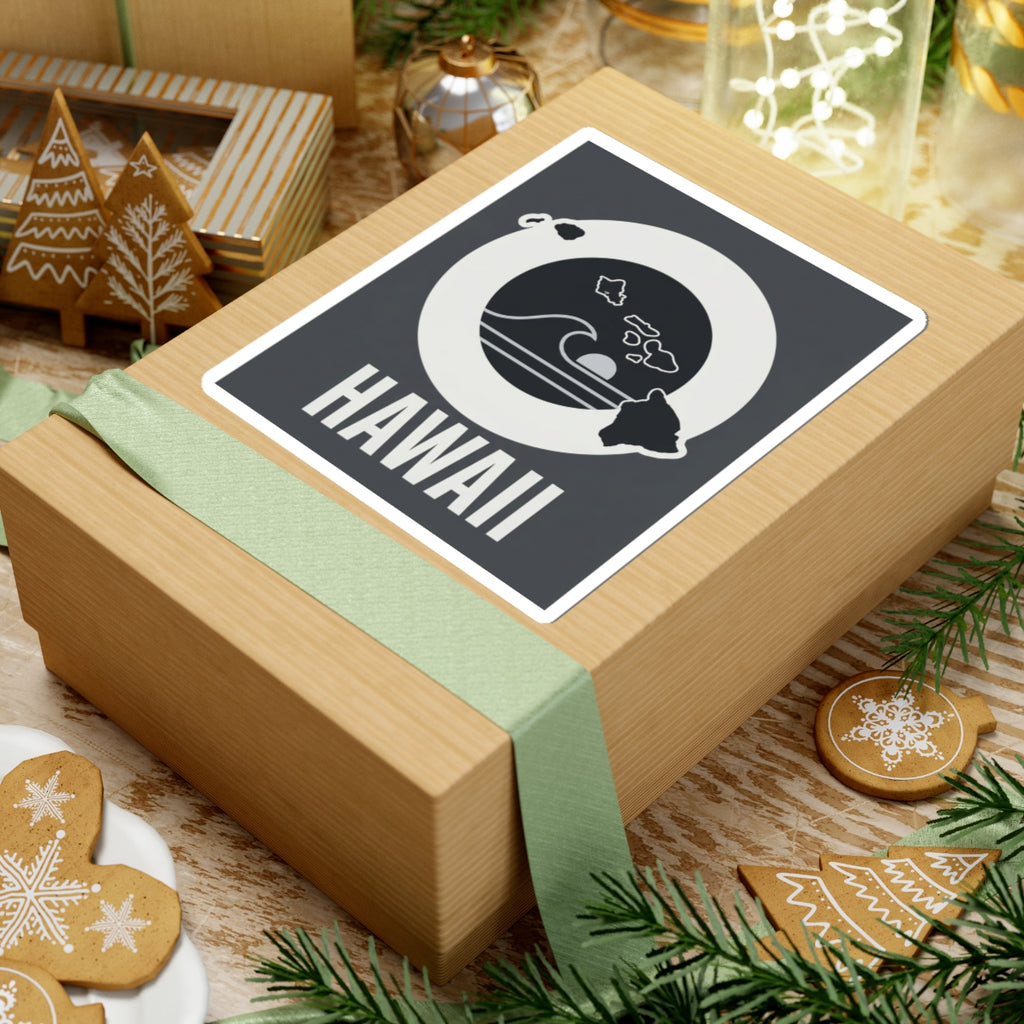 Square kiss-cut sticker on a gift box, black wave emblem with island details and HAWAII text