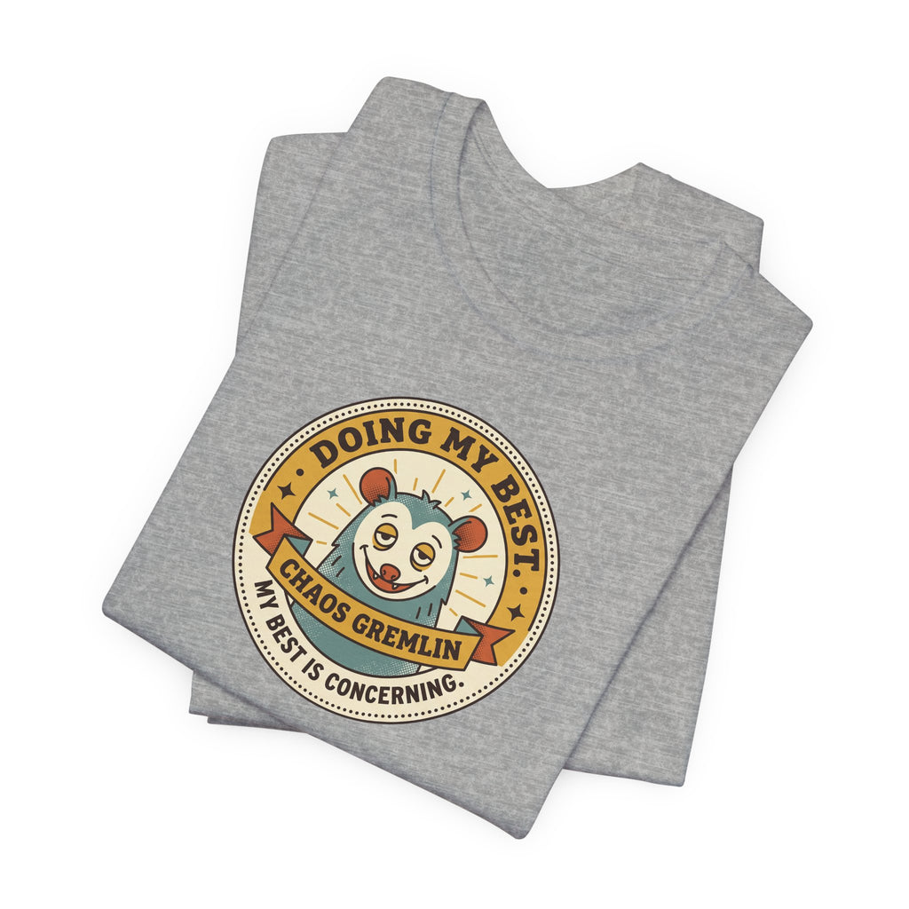 Dark gray crewneck T-shirt with round cartoon gremlin badge graphic, folded layout