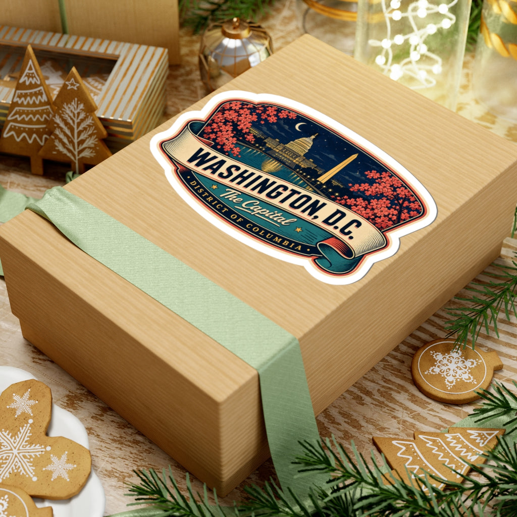 Luggage tag sticker on a gift box showing Washington D.C. skyline with pink blossoms and The Capitol