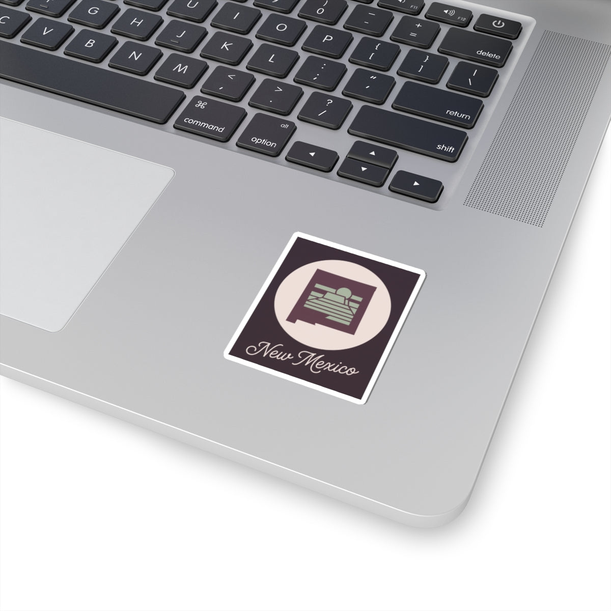 New Mexico state silhouette kiss-cut decal sticker on laptop keyboard