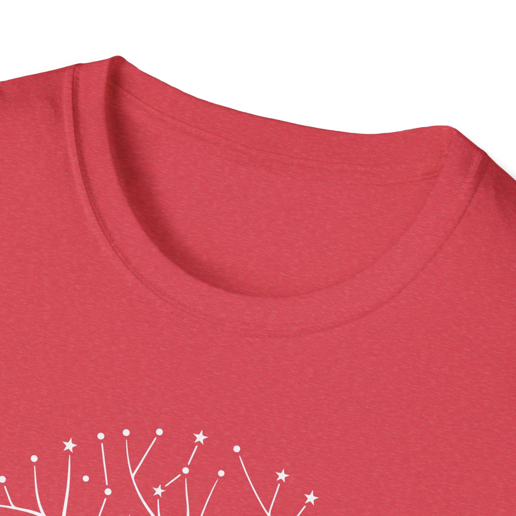 Red T-shirt close-up of crew neck; partial white star-and-tree roots graphic at bottom.