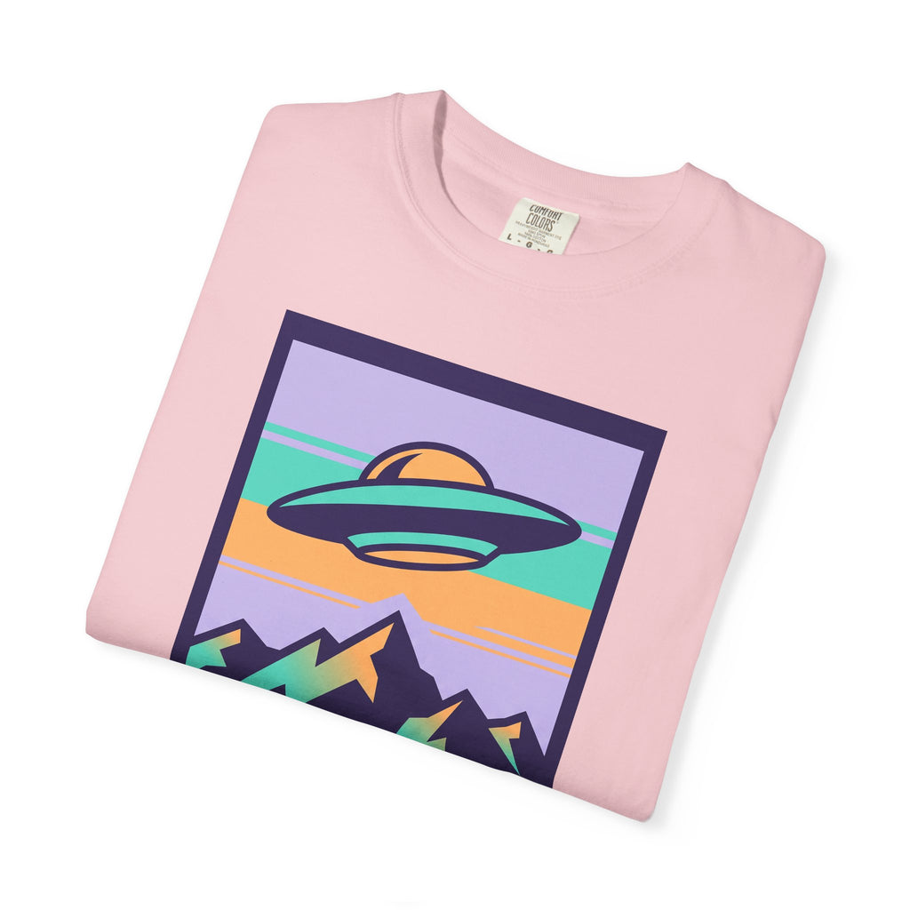 Pink T-shirt with UFO and mountains 'Visit Earth' graphic