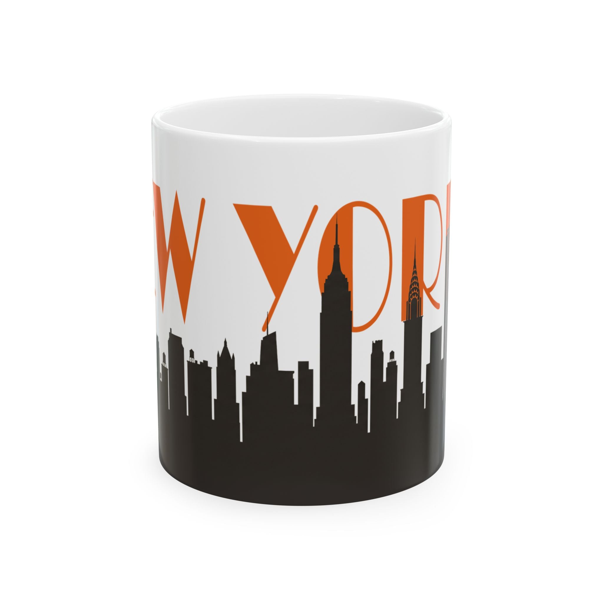 White ceramic coffee mug with orange “WYORK” text and black city skyline