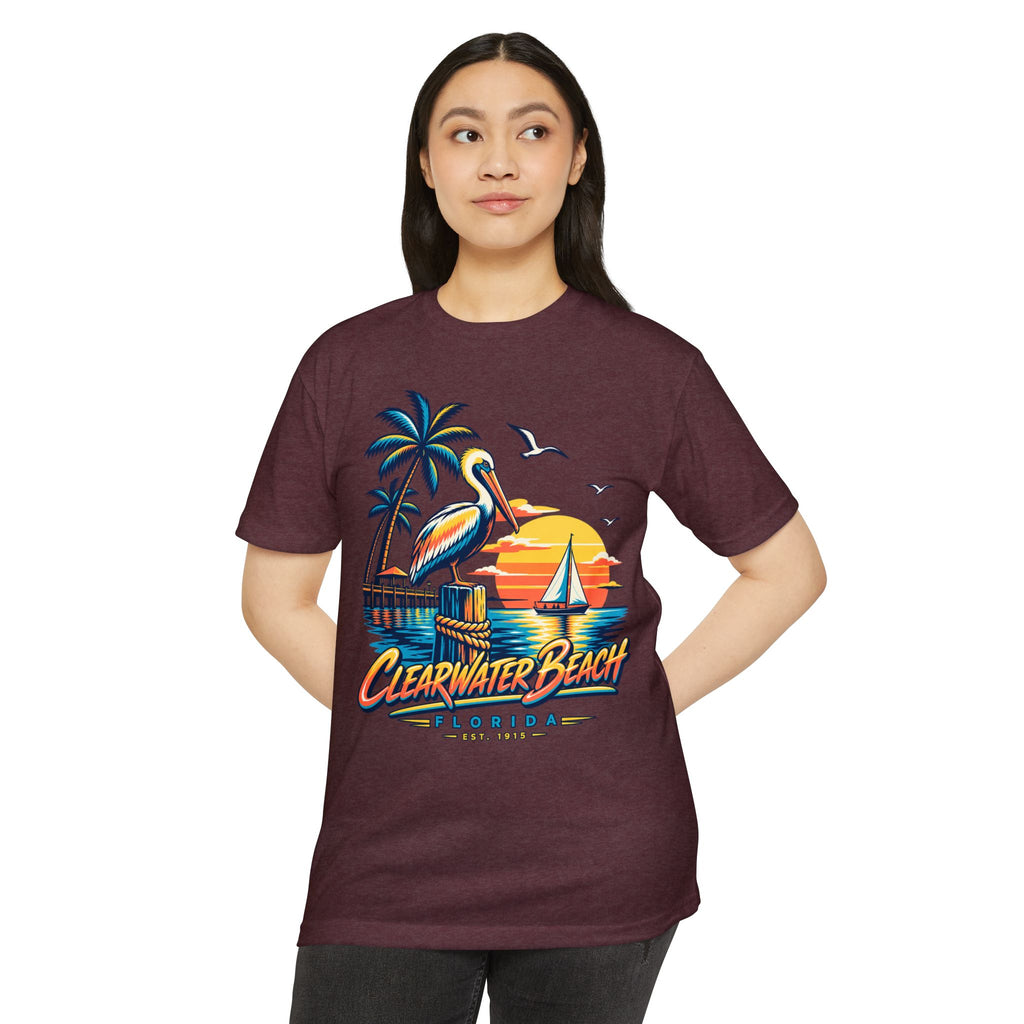Burgundy T-shirt with pelican, palm trees, and sailboat beach graphic.