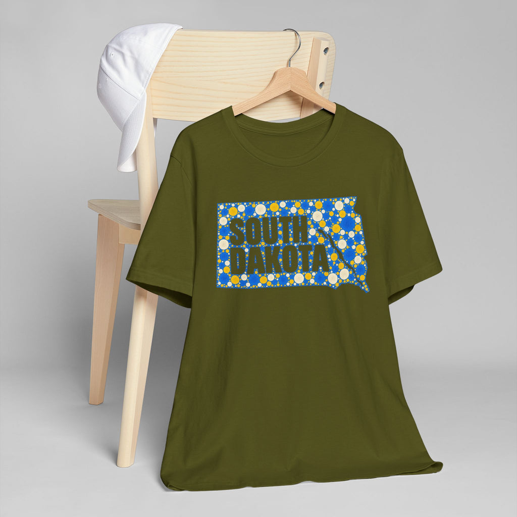 Olive green crewneck t-shirt with blue polka-dot South Dakota graphic on chest.
