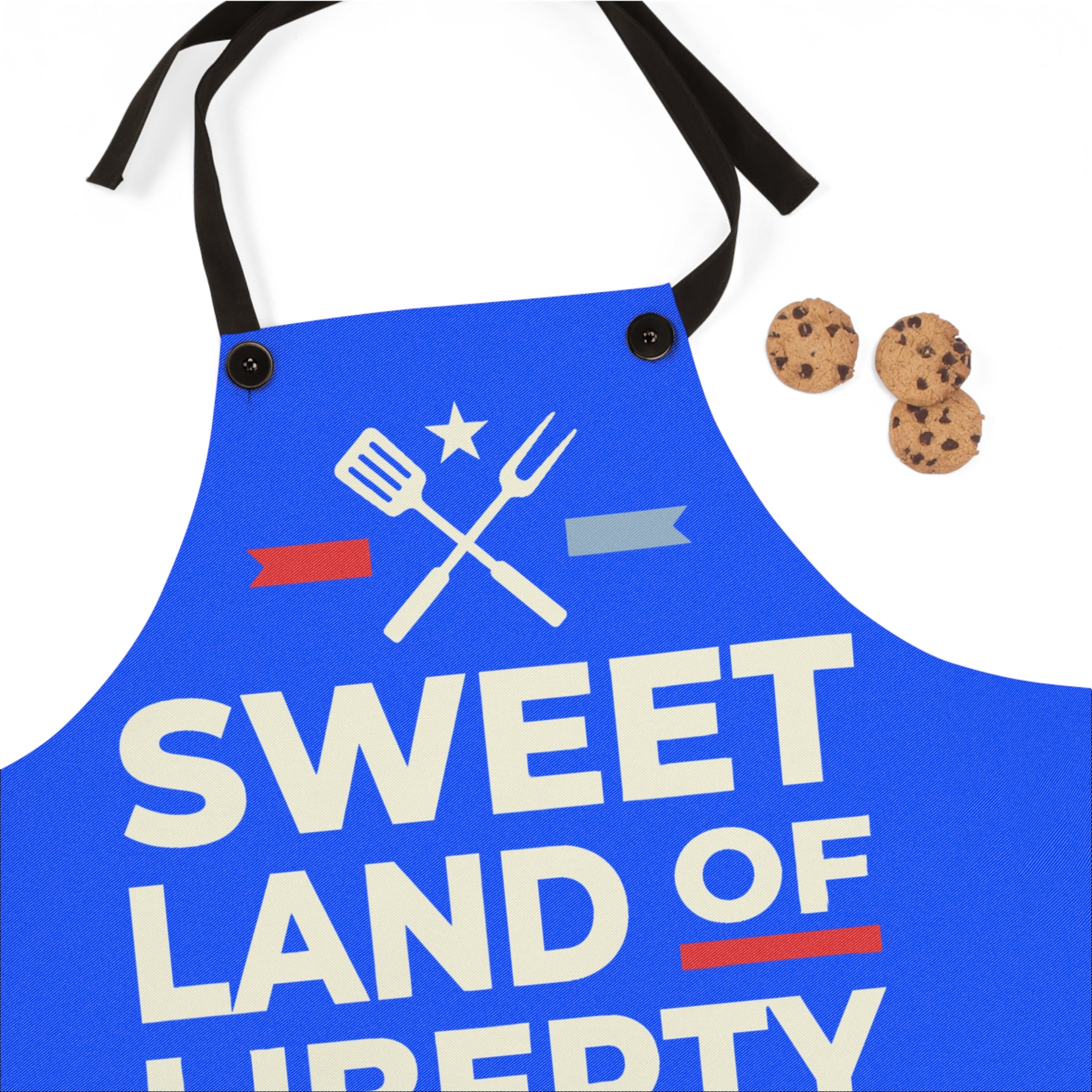 Blue BBQ apron front panel with 'SWEET LAND OF LIBERTY' text and crossed utensils