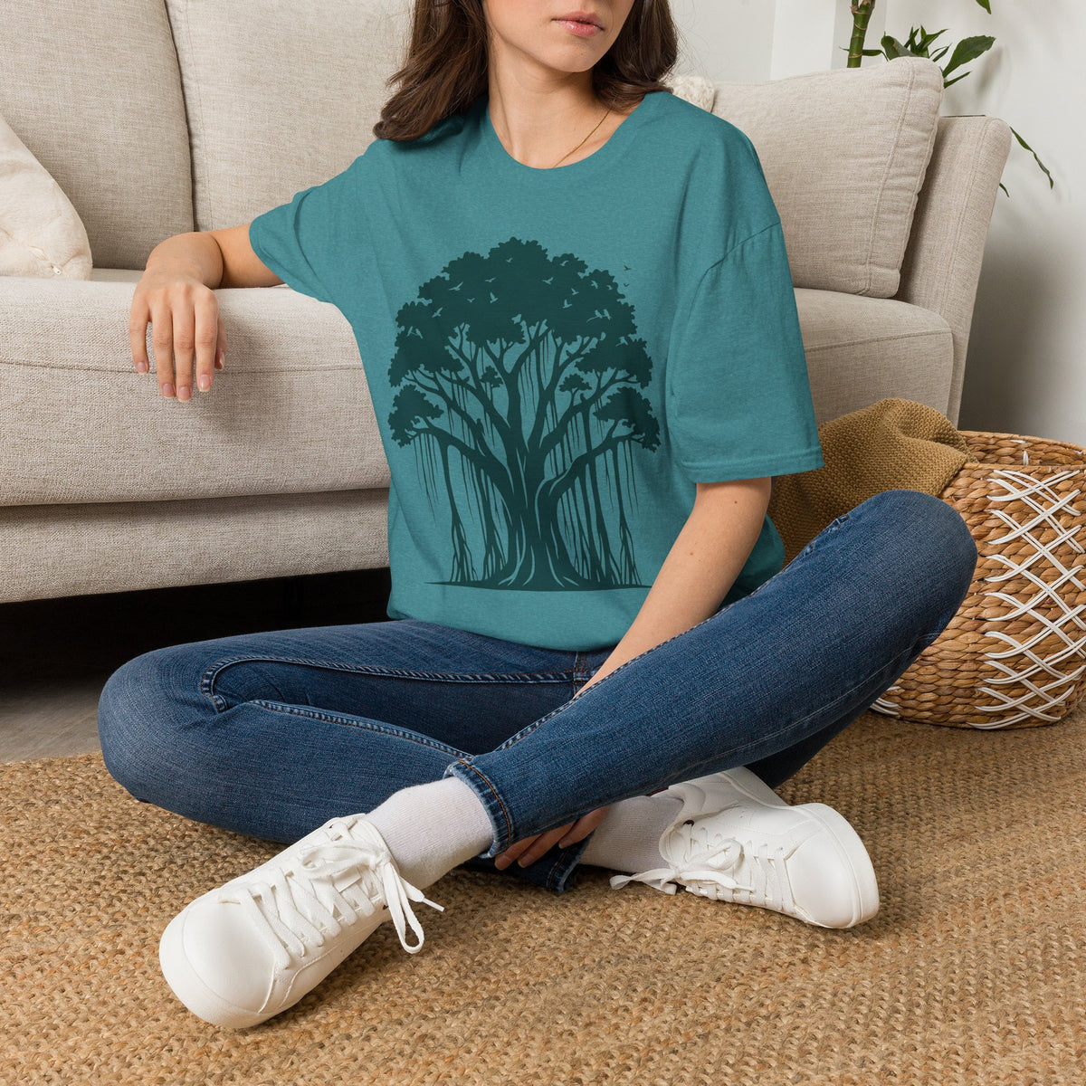 Teal crewneck t-shirt with dark banyan tree silhouette graphic on front