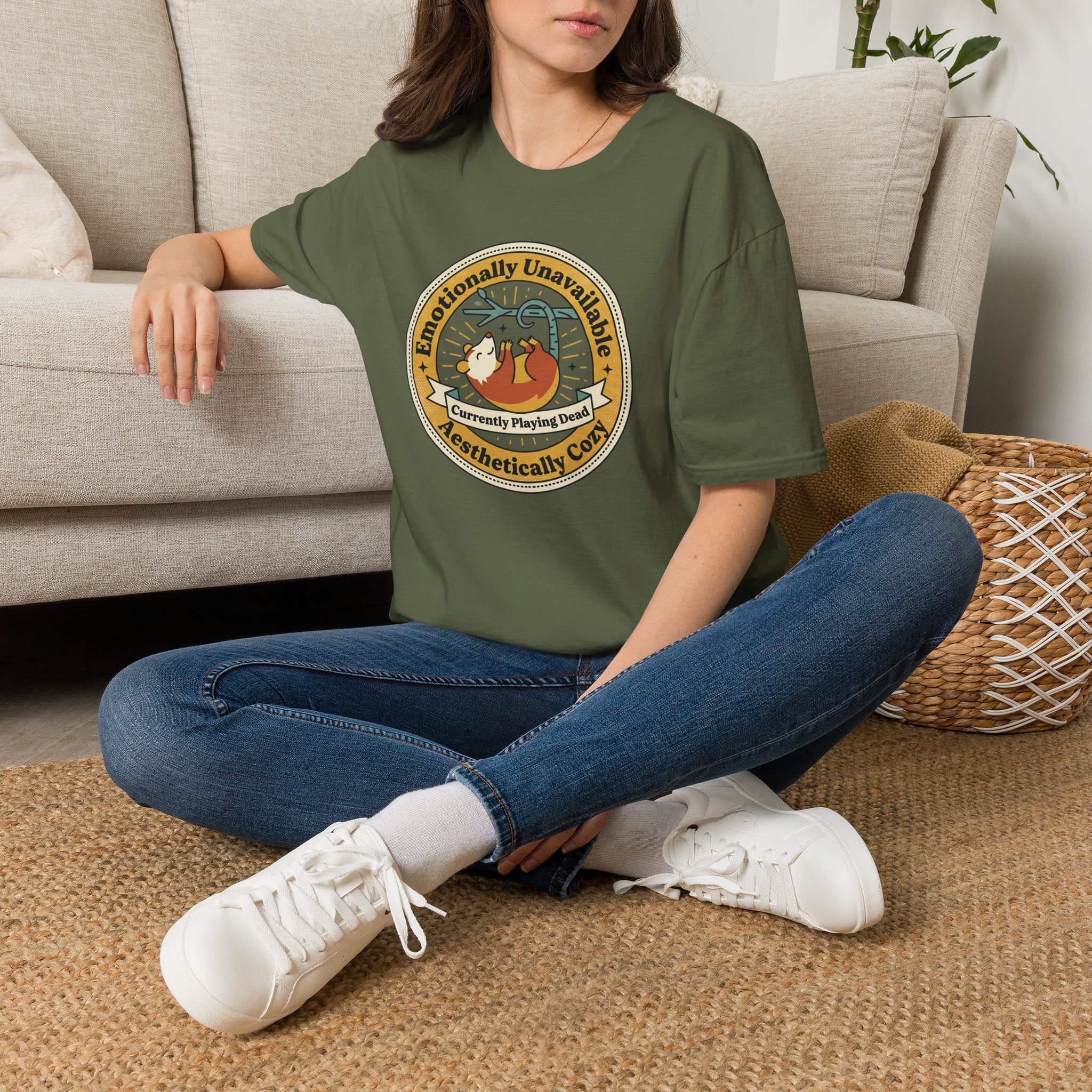 Military green sloth graphic T-shirt with circular “Emotionally Unavailable” logo