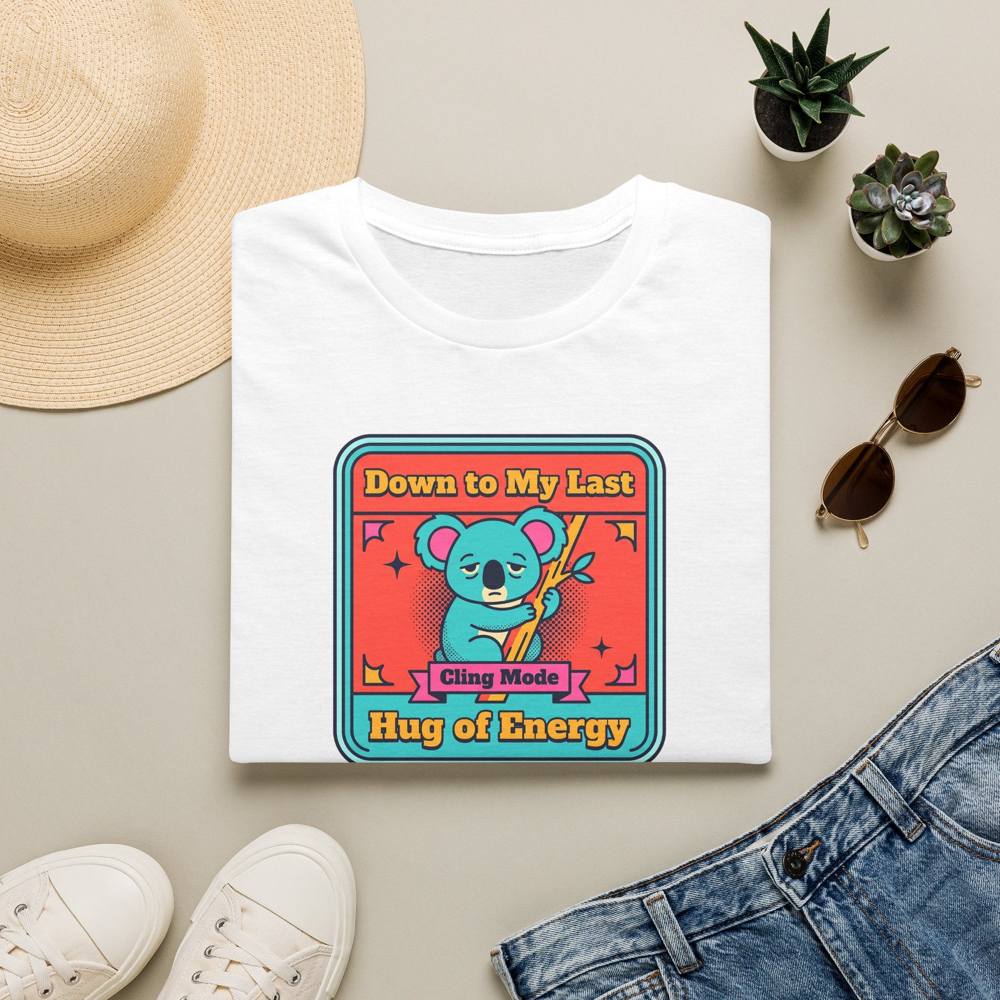 White koala graphic t-shirt with colorful badge-style front print