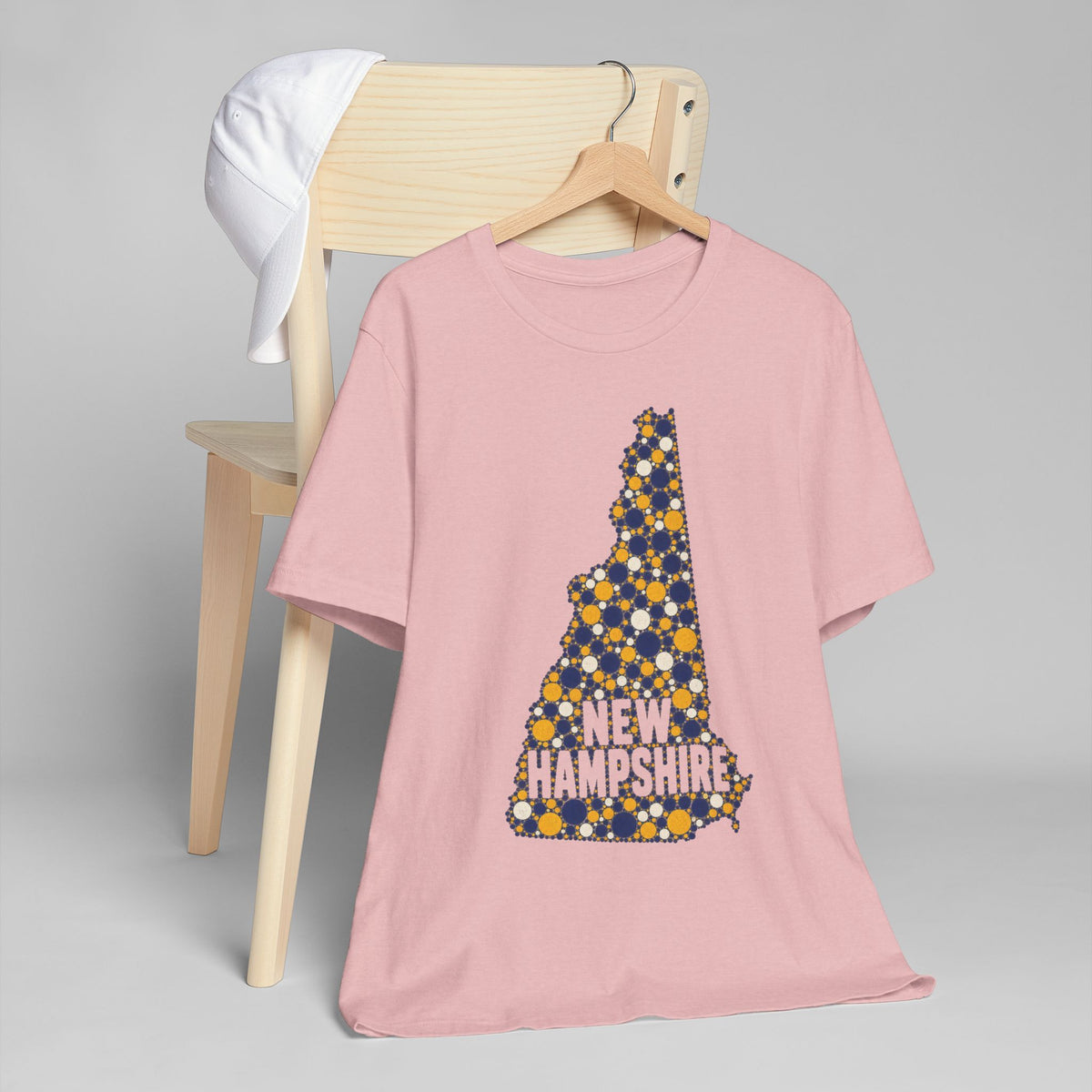 Pink crew-neck T-shirt with floral New Hampshire map graphic and “NEW HAMPSHIRE” text