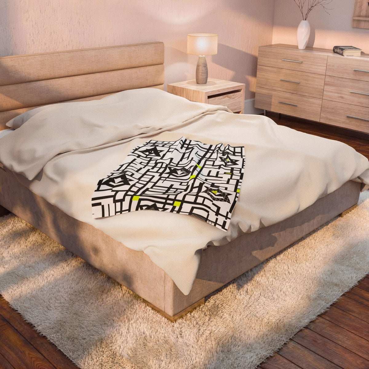 Geometric star plush blanket with black grid pattern and yellow accents on white