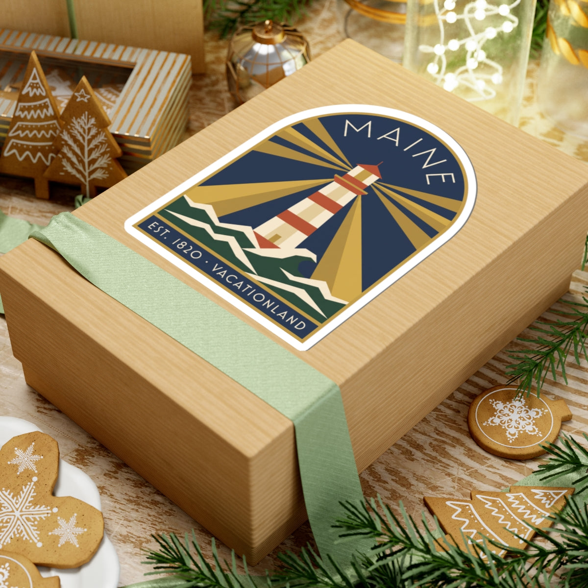 Maine lighthouse vinyl sticker on a gift, striped lighthouse tower with “MAINE” arch text