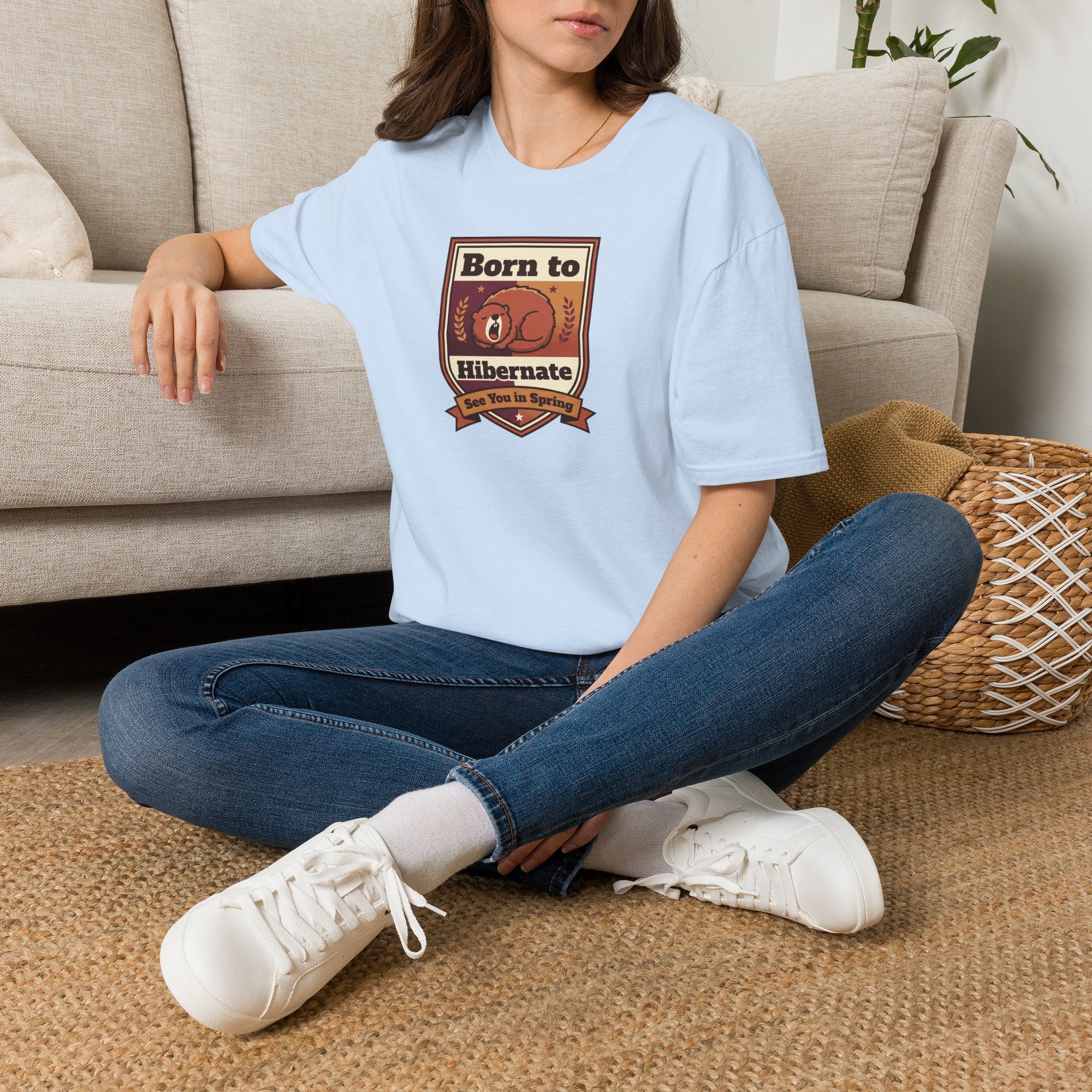 Light blue graphic T-shirt with “Born to Hibernate” bear emblem on the chest