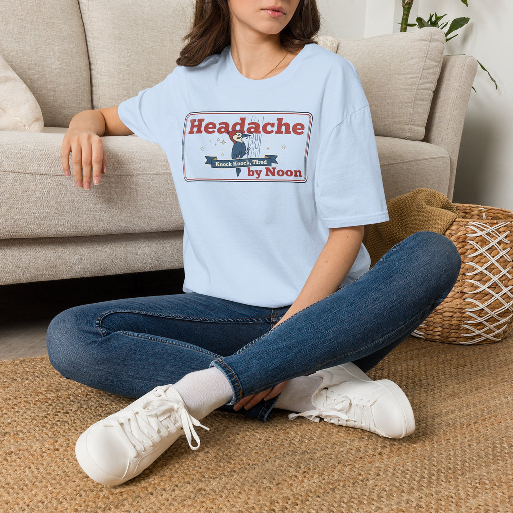Light blue crewneck t-shirt with 'Headache by Noon' rectangular graphic