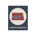 North Dakota metal wall sign with oval logo, red state graphic, and “NORTH DAKOTA” text