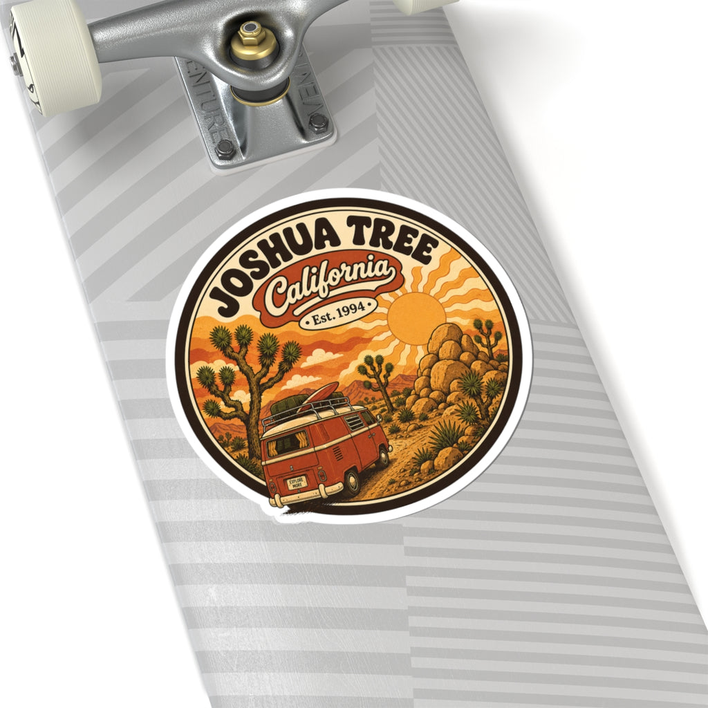 Round sticker with white border, Joshua Tree California Est. 1994, red camper and rocks