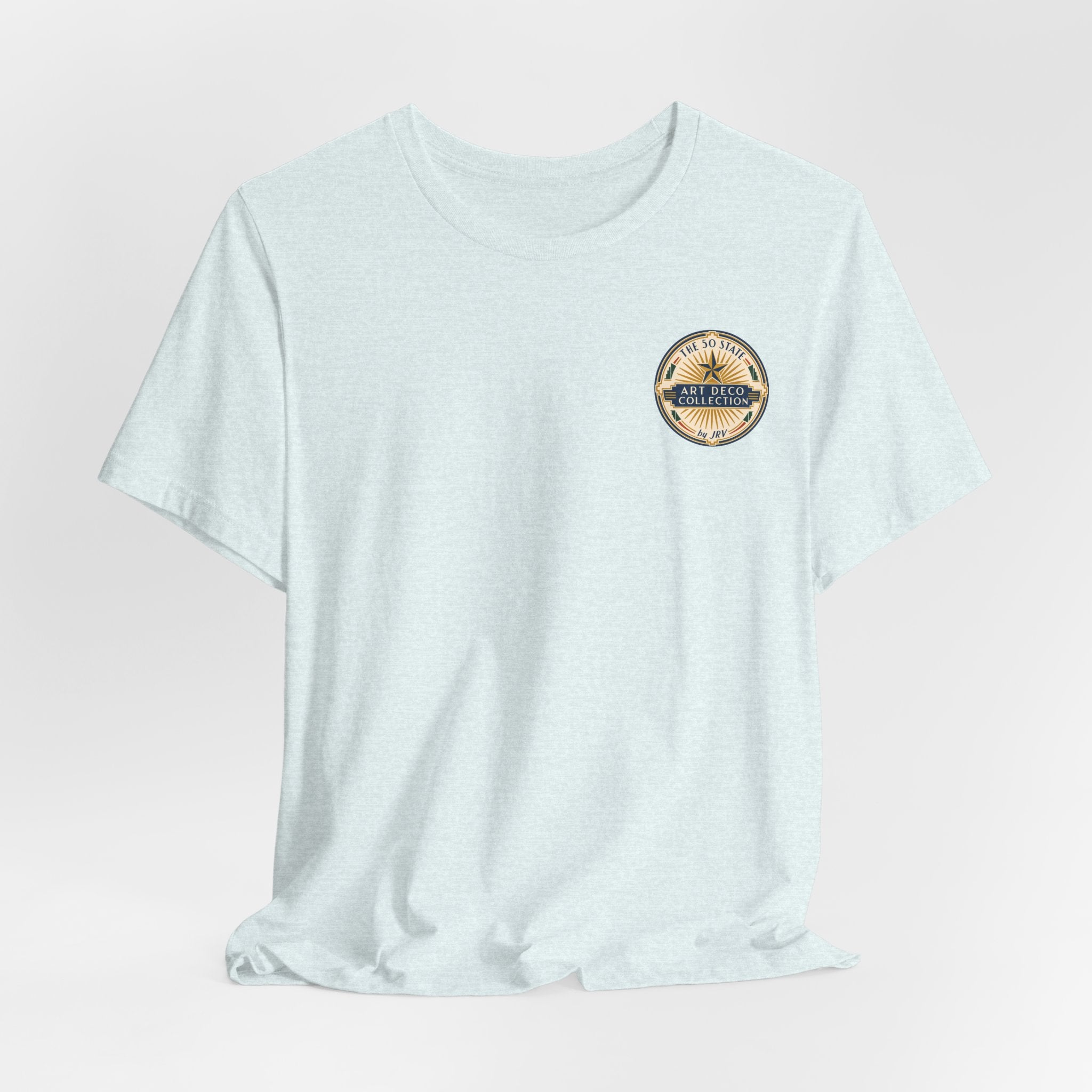 Light aqua T-shirt with small circular badge on left chest