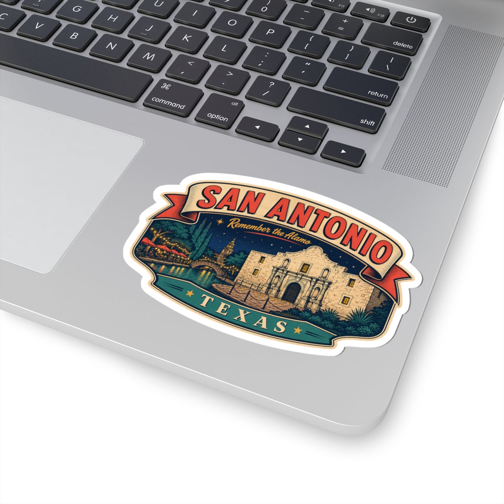 San Antonio luggage tag sticker on laptop, red SAN ANTONIO banner and teal TEXAS ribbon
