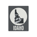 Idaho metal wall art sign with state silhouette in circle and "IDAHO" text