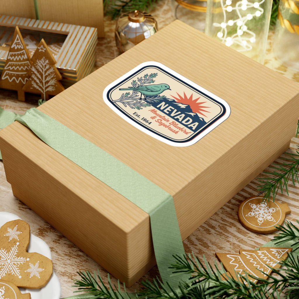 Nevada vintage sticker on a gift box lid, showing bluebird, sagebrush, mountain, Est. 1864.
