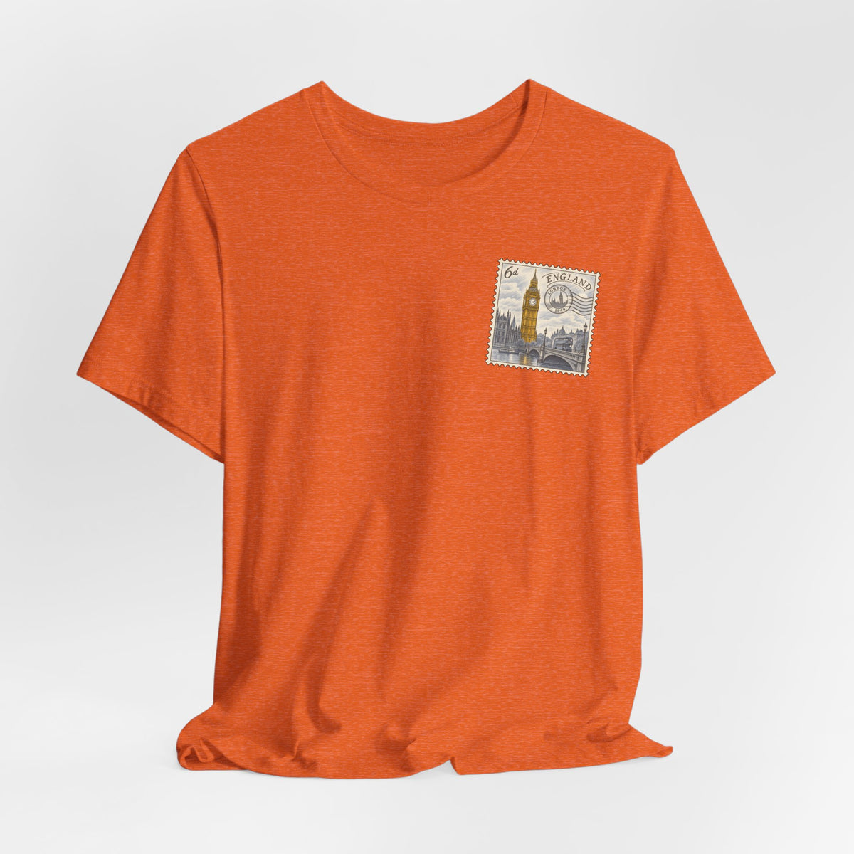 Orange crew-neck T-shirt with postage-stamp graphic on left chest