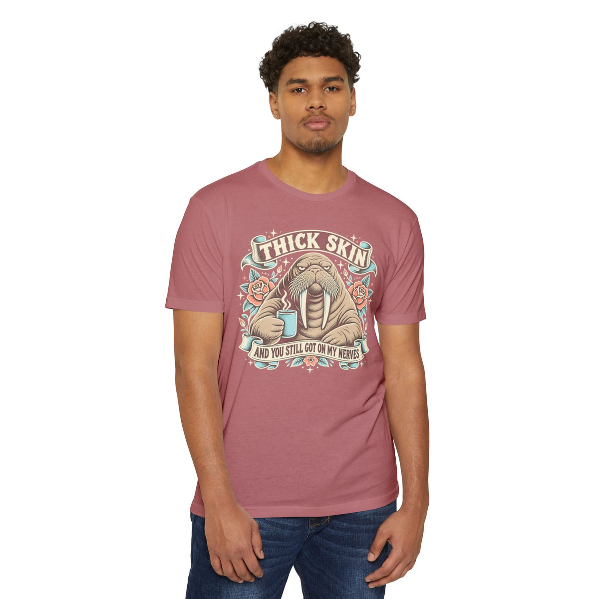 Rose-pink short-sleeve T-shirt with walrus coffee graphic and “THICK SKIN” text front