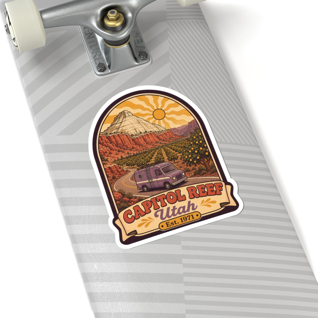 Die-cut sticker on striped notebook, retro camper van in canyon with CAPITOL REEF Utah Est. 1971