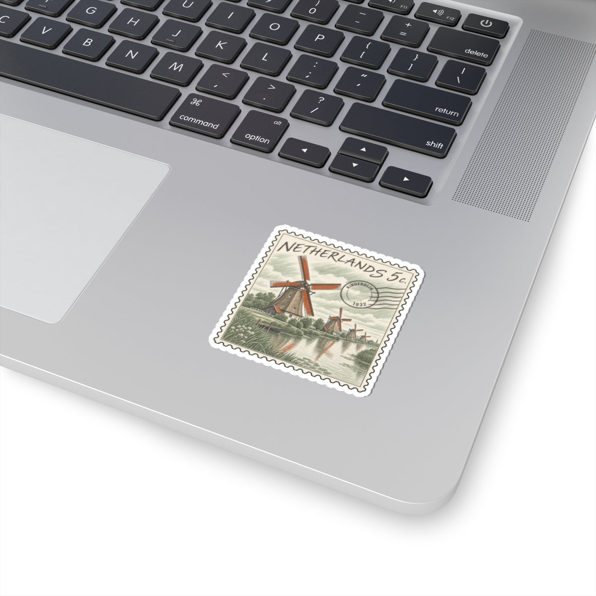 Stamp-style Netherlands 5c sticker with red windmill, canal scene, and scalloped edge