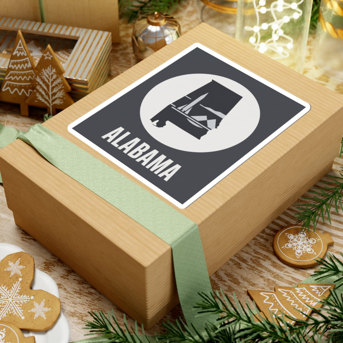 Alabama outline vinyl decal on gift box, square dark sticker with white border, circle emblem, “ALABAMA”