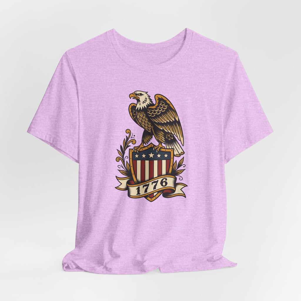 Light pink crewneck T-shirt with eagle, stars, and 1776 shield graphic