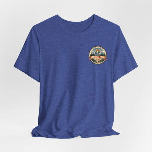 Blue short-sleeve T-shirt with small circular logo graphic on the left chest.