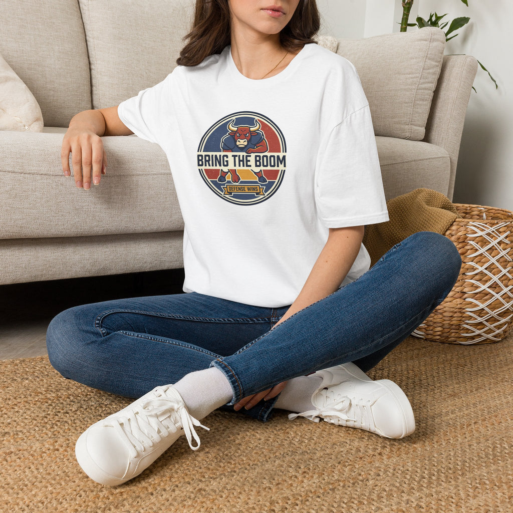 White T-shirt worn by model, with circular bull mascot “BRING THE BOOM” chest graphic