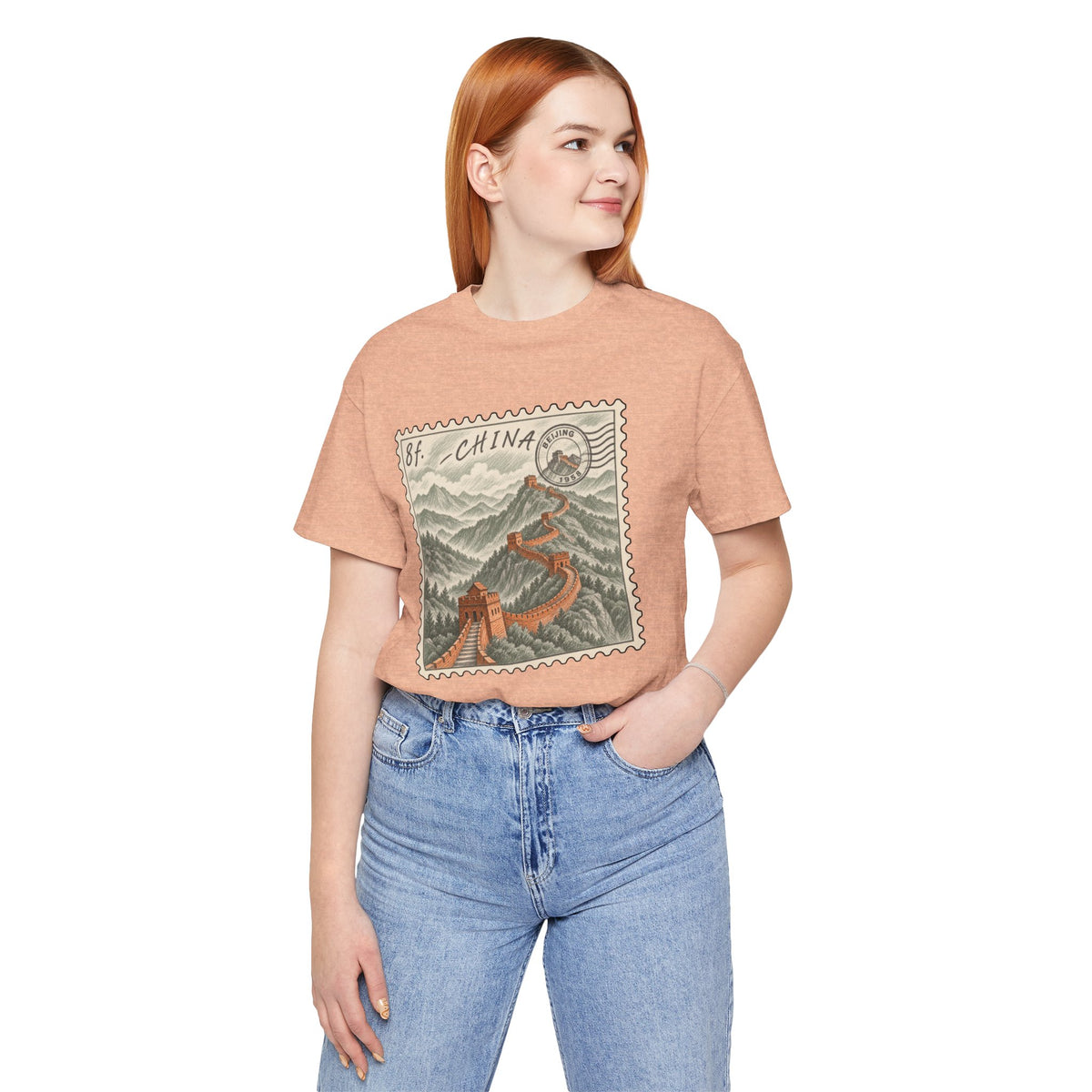 Peach crew-neck T-shirt with vintage China postage stamp graphic on chest