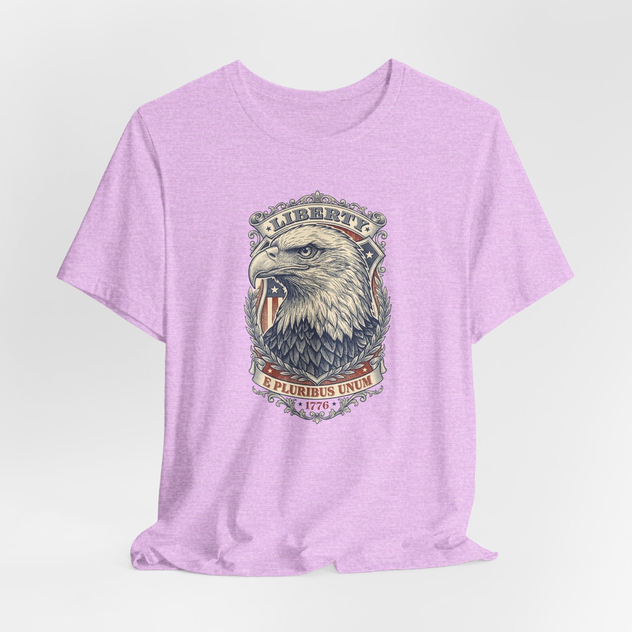 Lavender T-shirt with centered eagle head graphic in a circular badge