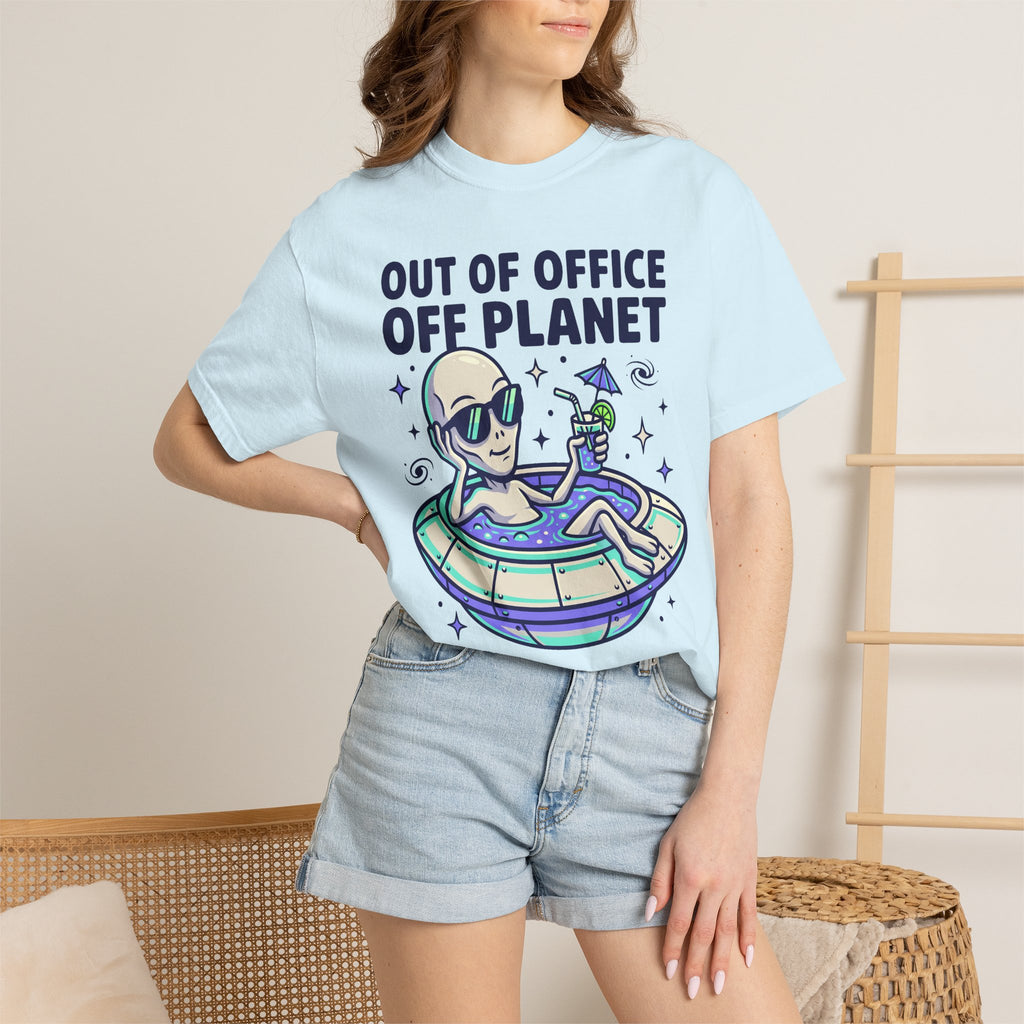 Light blue T-shirt worn by model with alien astronaut floatie graphic and blue text