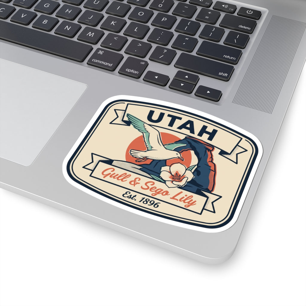 Utah sticker decal on laptop showing gull, sego lily, and “Est. 1896”