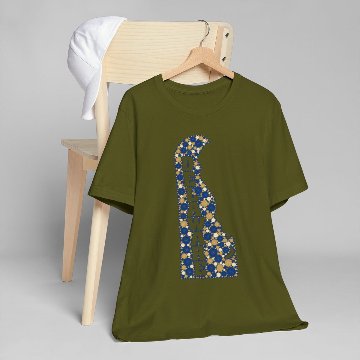 Green Delaware silhouette graphic T-shirt with blue and gold mosaic pattern