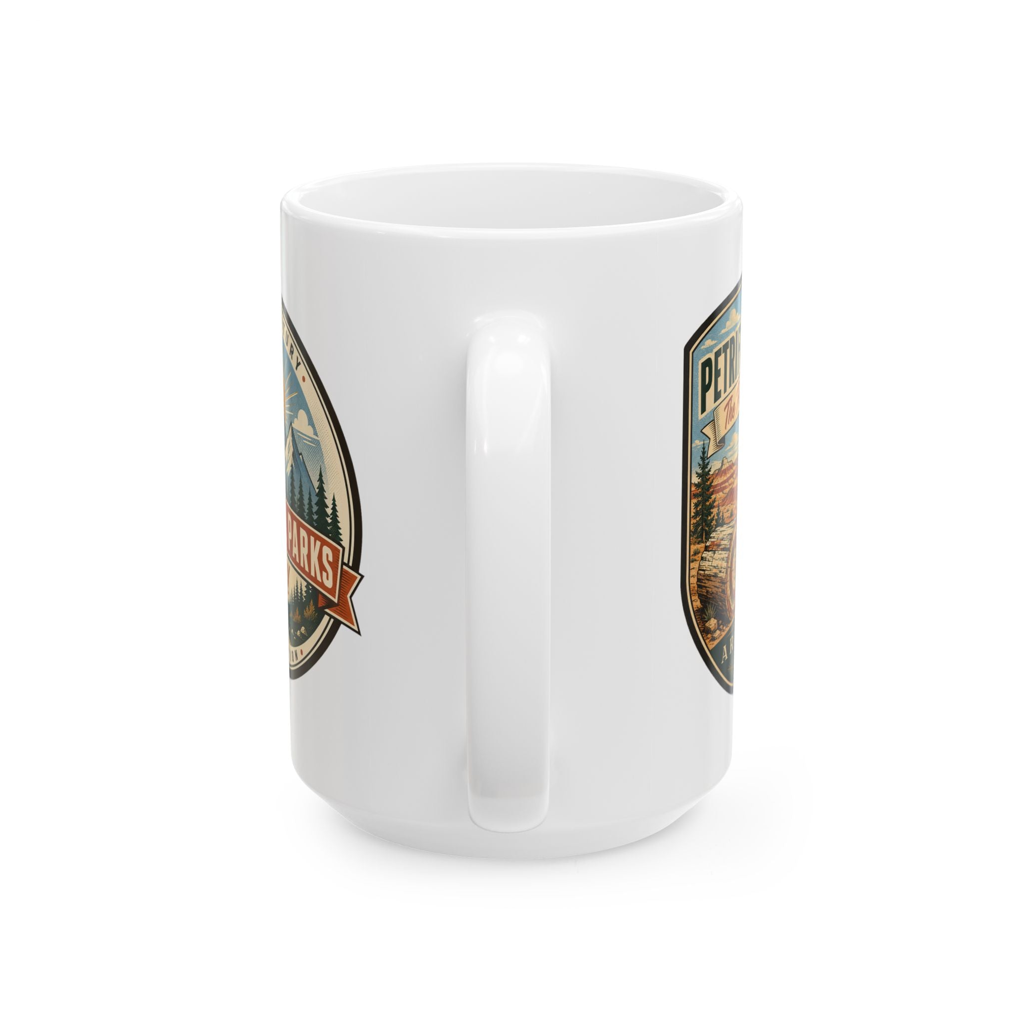 White ceramic mug showing partial side graphics in shield badges, trees and desert