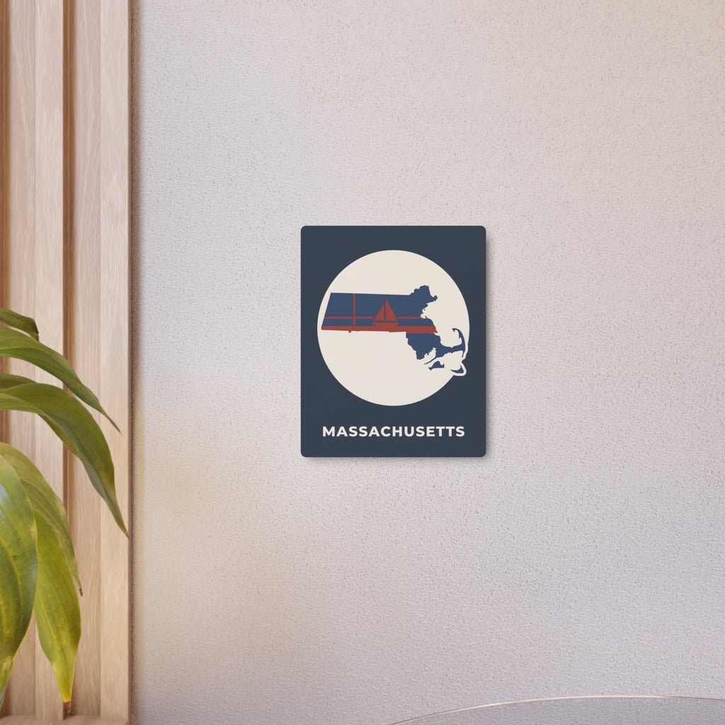 Metal state map art sign mounted on wall, showing circular Massachusetts silhouette and stripes.