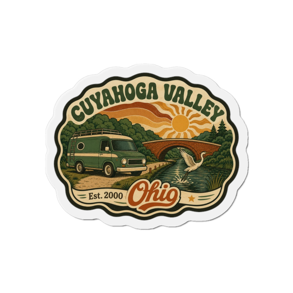 Die-cut fridge magnet with Cuyahoga Valley scene, retro camper and sunset, Ohio text.