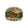 Die-cut fridge magnet with Cuyahoga Valley scene, retro camper and sunset, Ohio text.